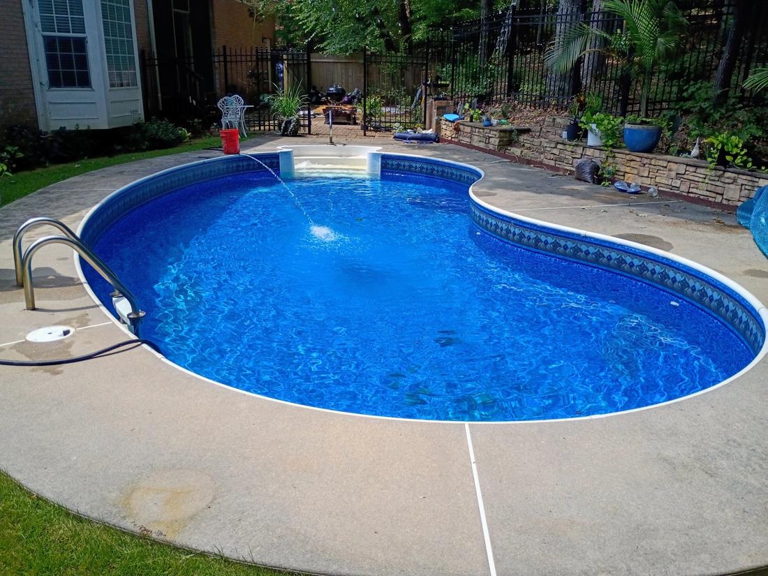 Finished kidney pool filling with clear blue water
