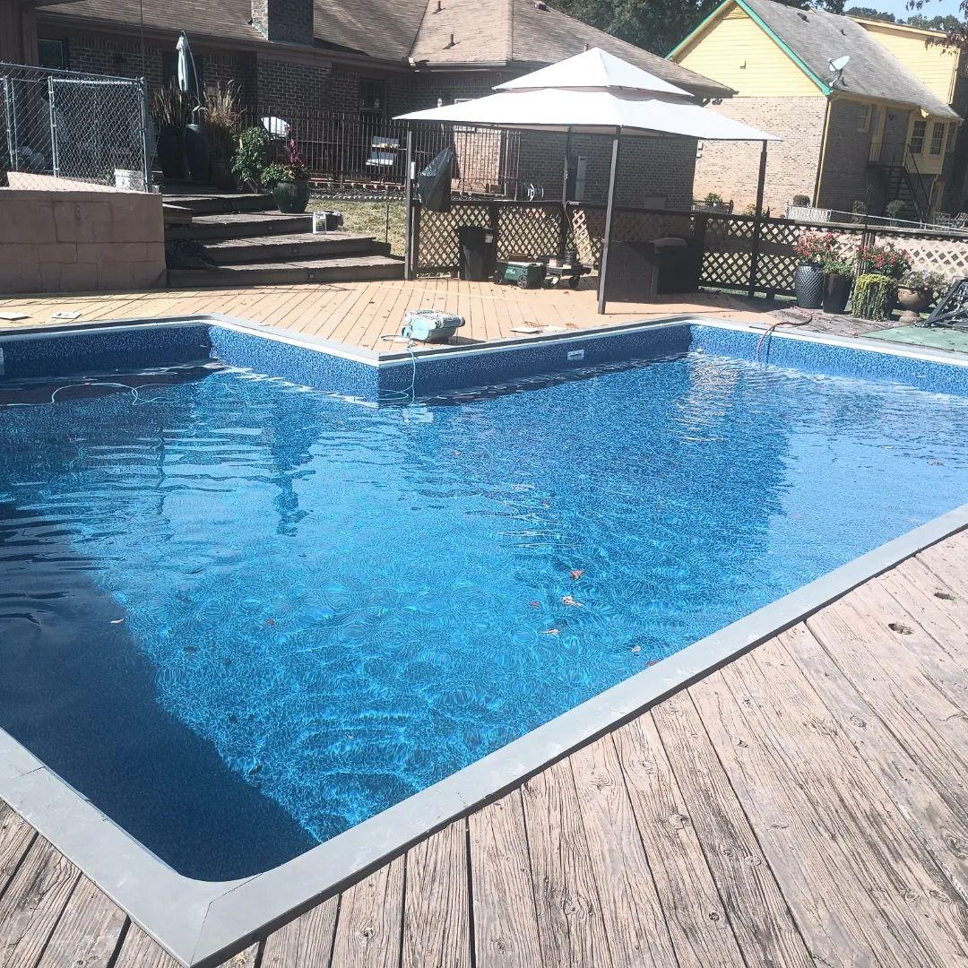 Same rectangular pool filled with a new blue liner