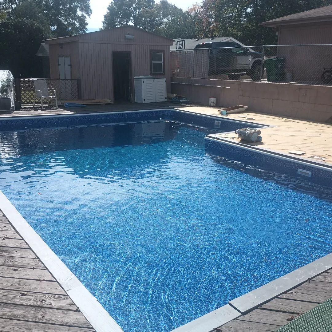 Another angle of the finished pool showing the new liner and step bench
