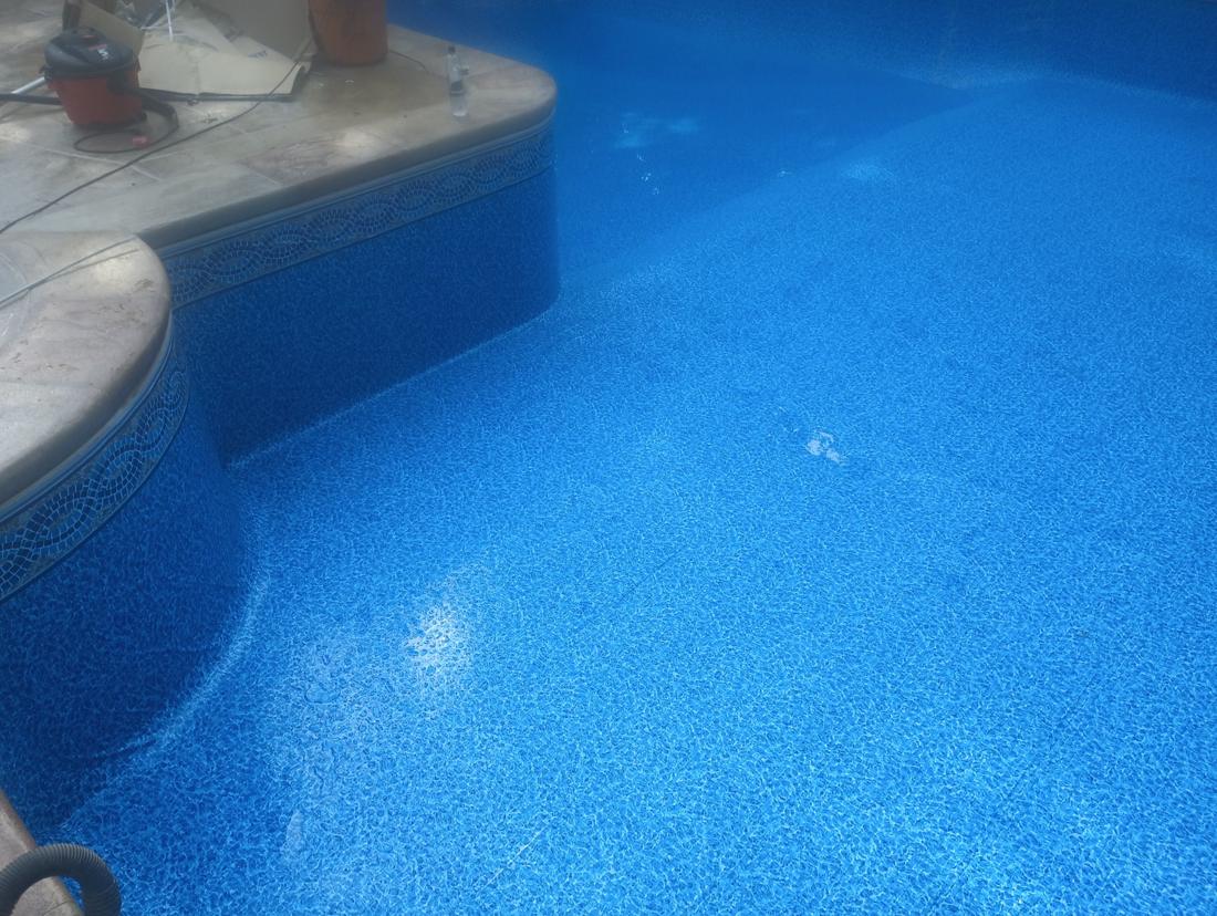 New liner smooth across the floor as water comes in