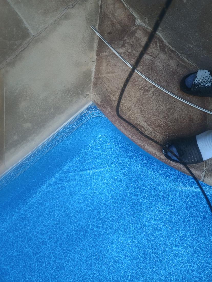 Close-up of the new liner and border tucked into a corner