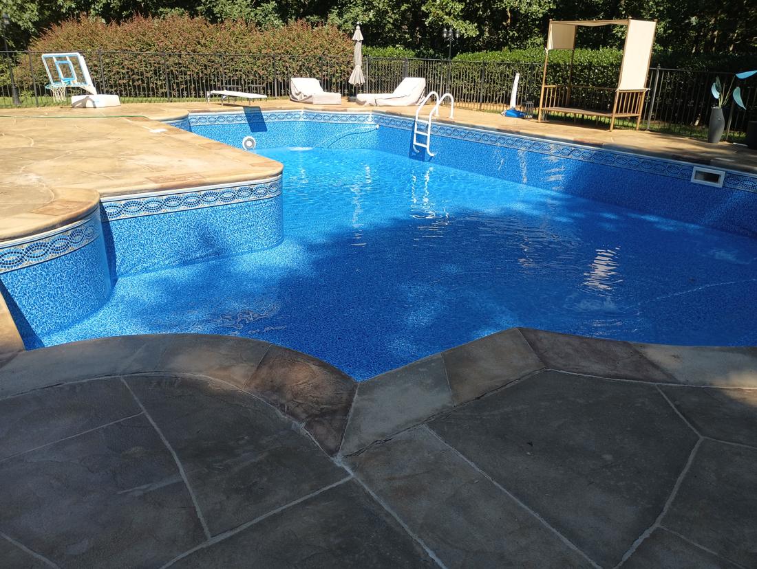 Finished pool with the new liner, ladder and diving board