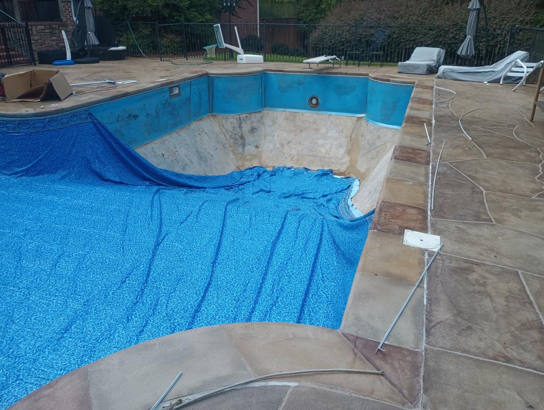 Old liner out, new liner going in over bare walls