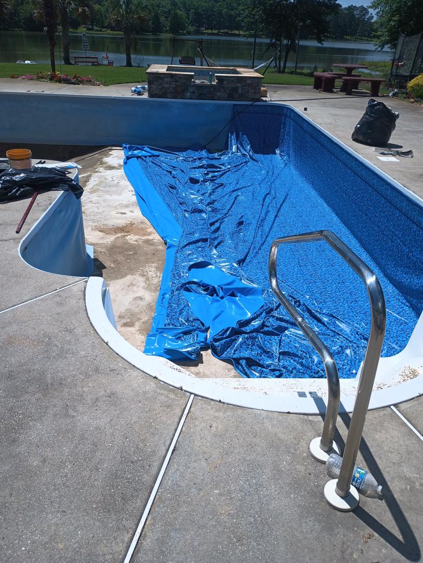 New mosaic liner being set into the pool