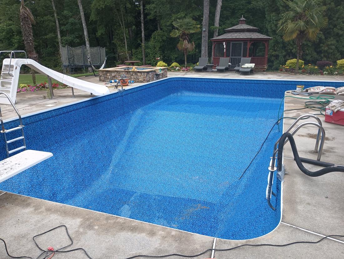 New liner set and vacuumed in, seen toward the gazebo