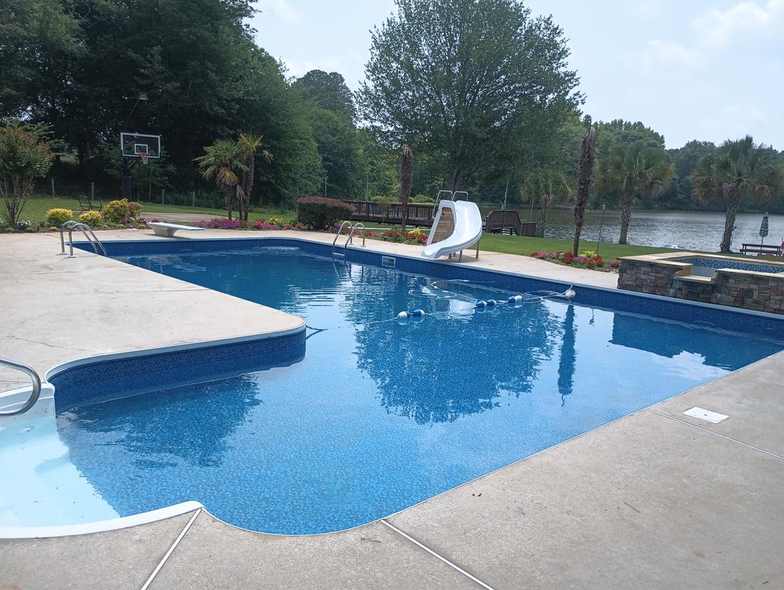 Finished pool with the lake behind it