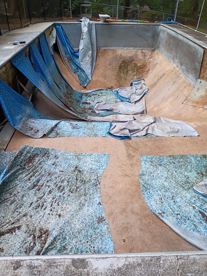 Old liner cut out and pulled from the pool