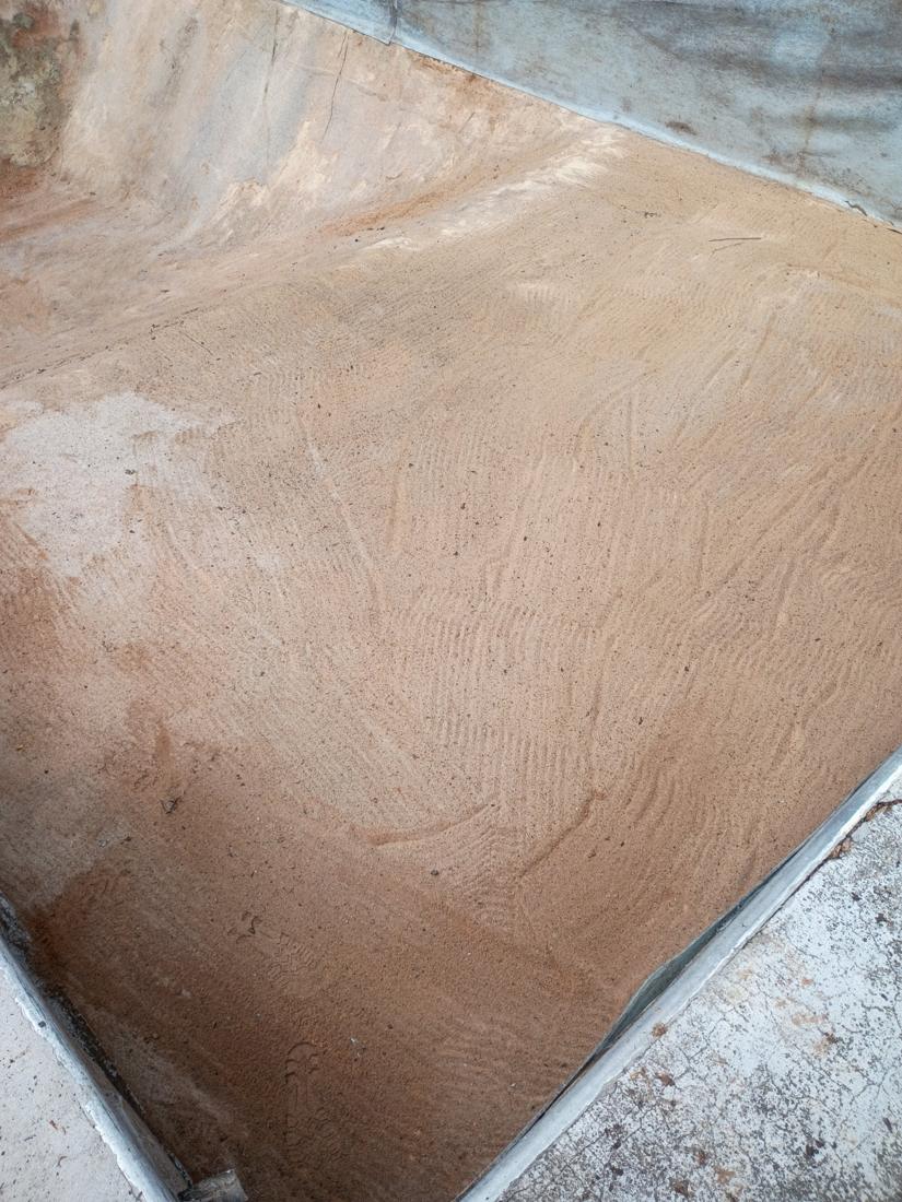 Bare pool floor after the old liner came out