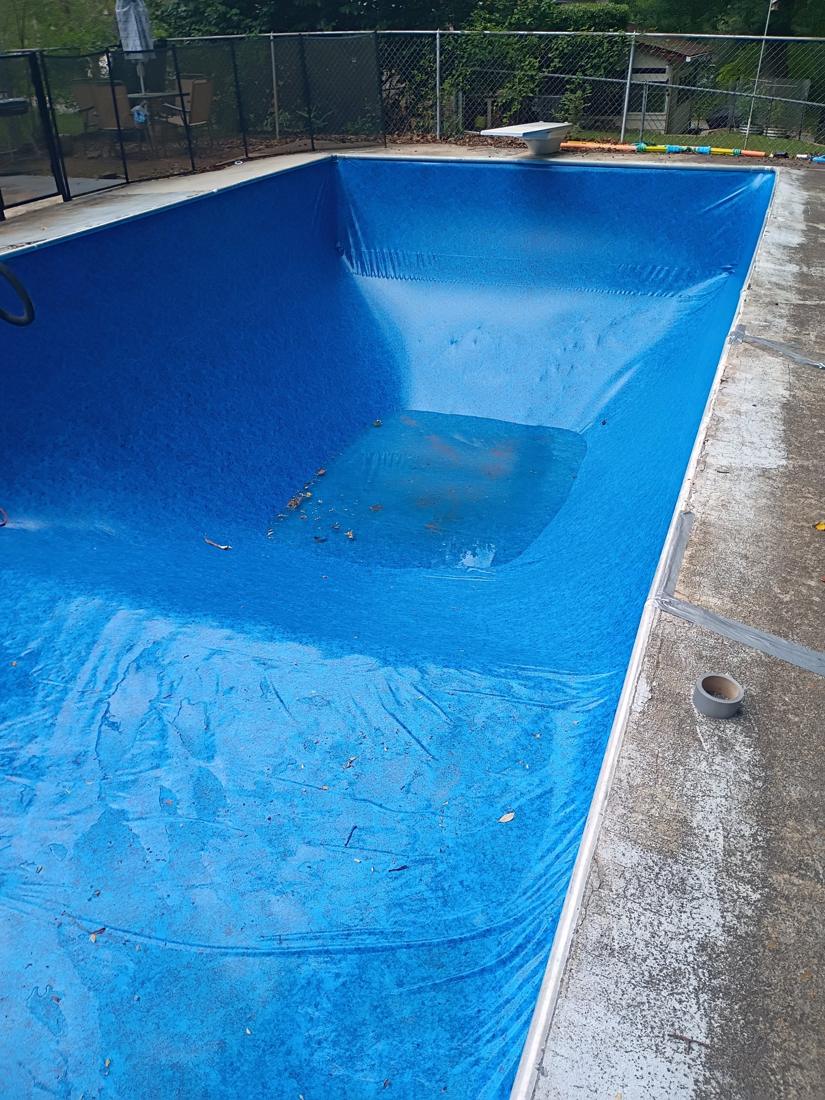 New liner vacuumed to the walls with water starting to fill