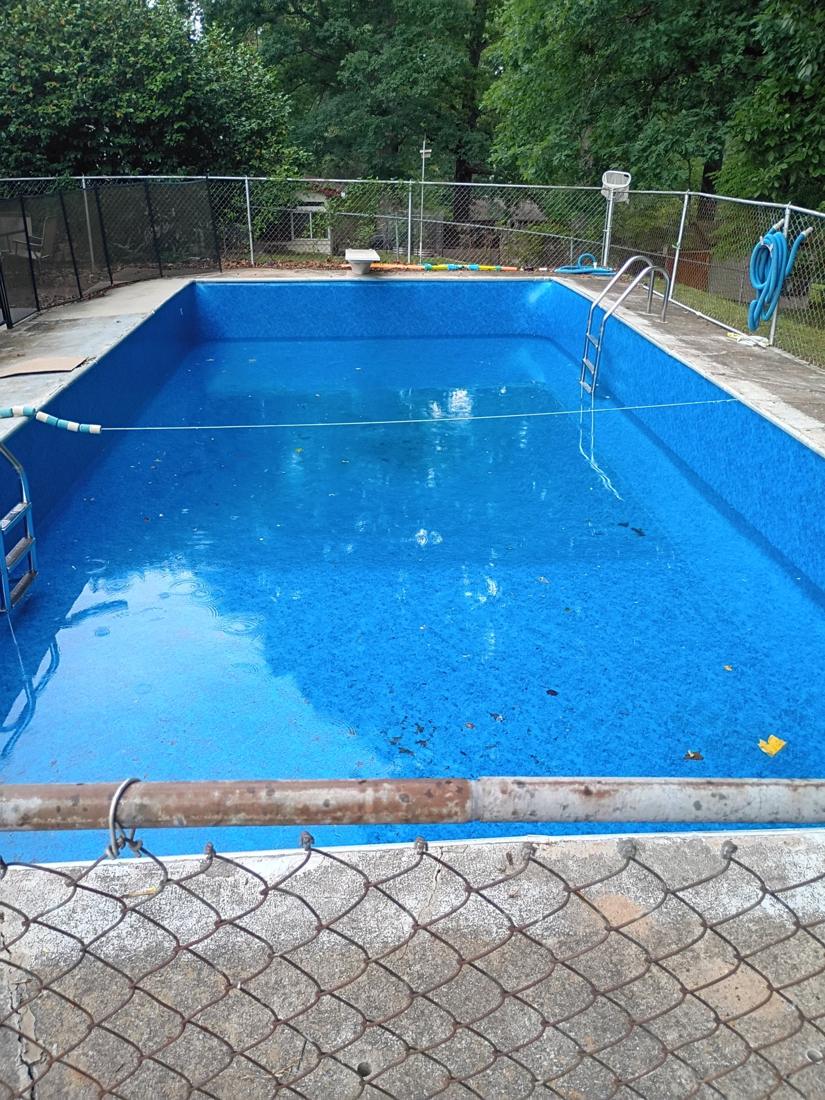 Filled pool with the new liner and ladders back in