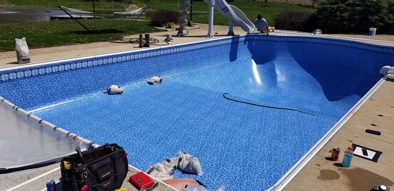 A real Vinyl Pool Liners Direct installation, backyard pool with slide